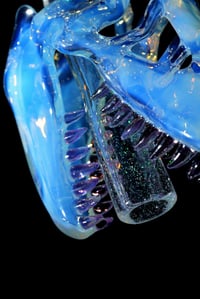 Image 4 of Glopal (uv reactive) T-Rex skull pendant with dichro tip and crushed opal teeth. 