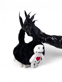 Image 1 of cursed cuddle plush muffs