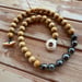 Image of Tahitian pearl necklace with sandalwood beads and a tiger puka shell clasp