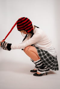 Image 1 of Red and black ear flap beanie