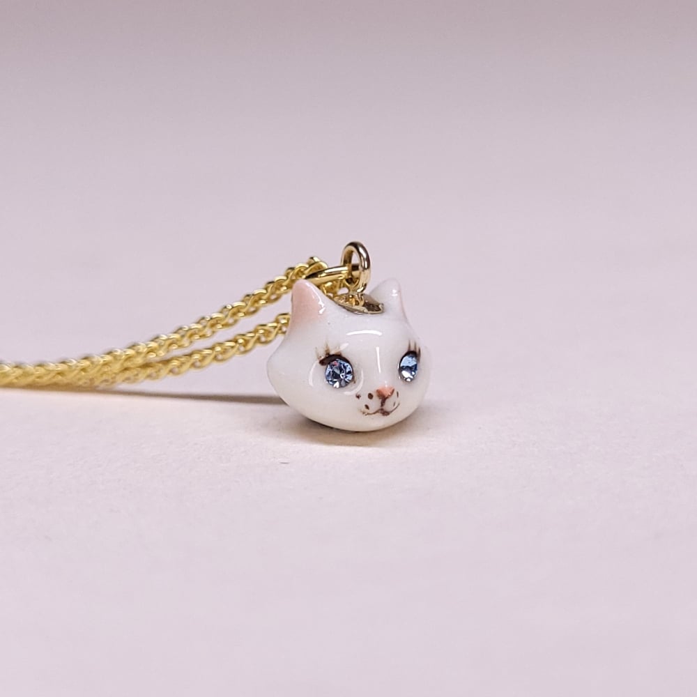 Image of White Porcelain & Gold Vermeil Teeny Tiny Cat Pendant