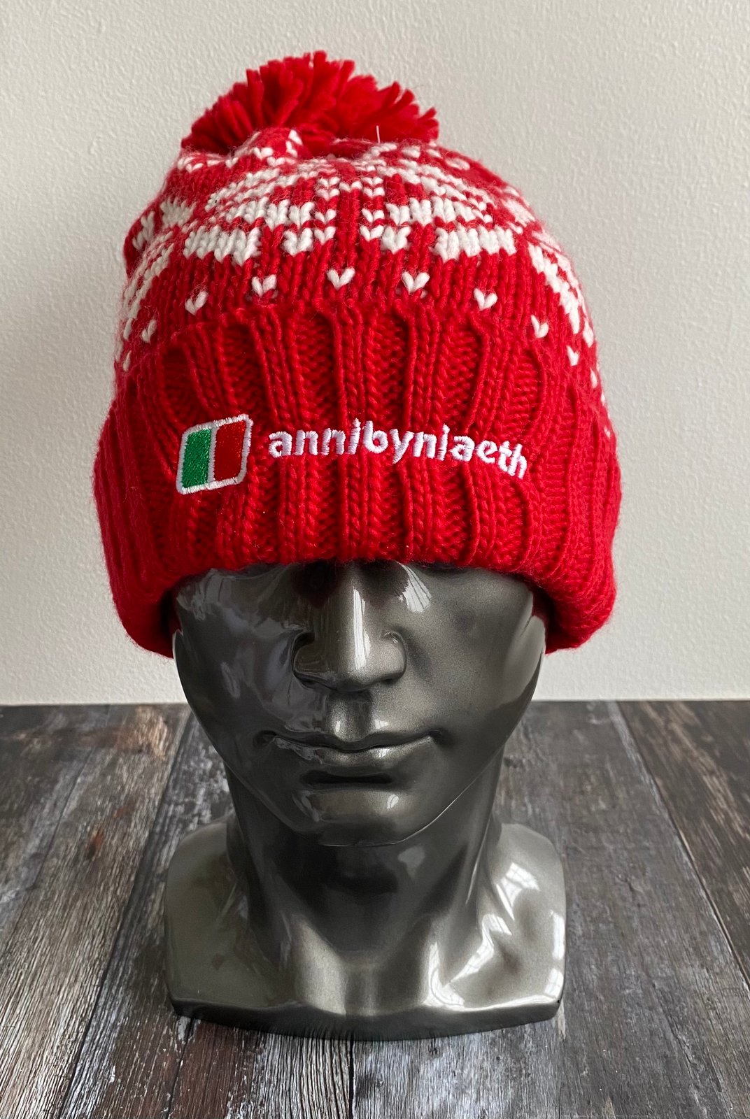 red and white bobble hat