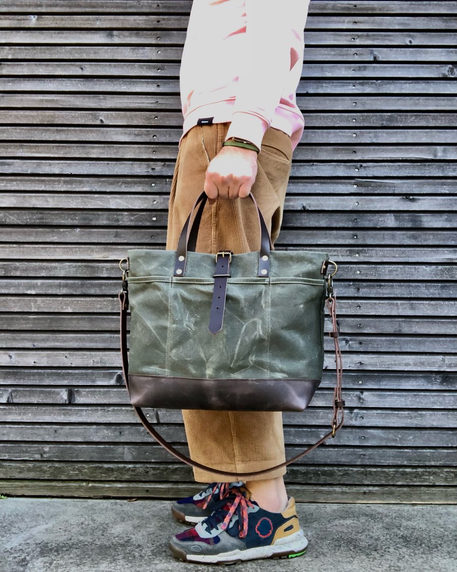 Image of Carryall  tote bag in olive green waxed filter twill with leather bottom and cross body strap