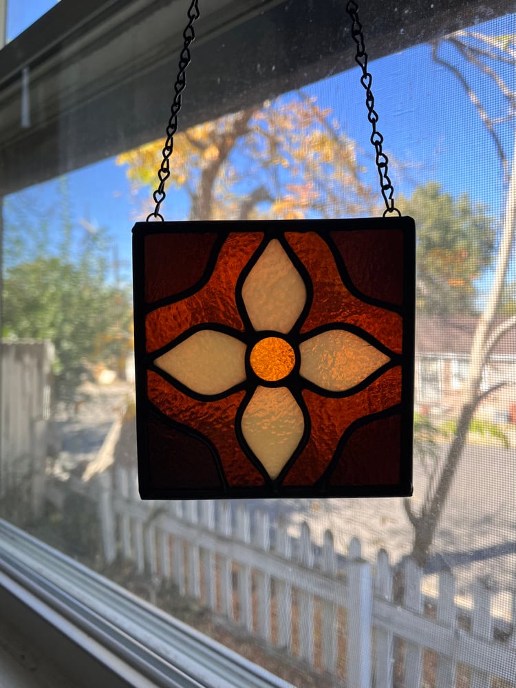 Image of Dark amber flower tile