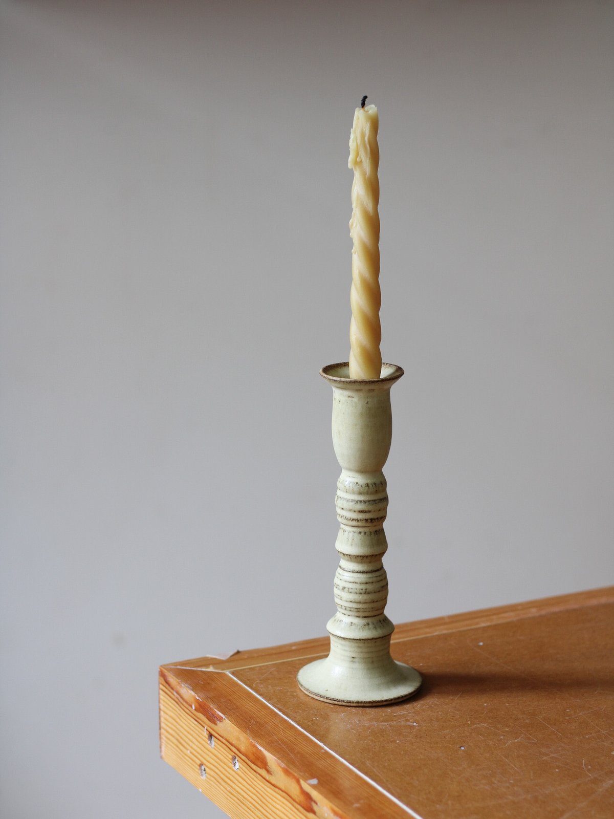 Image of long candle holder in ochre