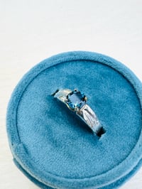 Image 1 of sterling silver feather ring with blue topaz 