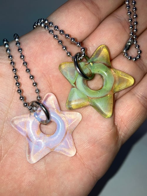 Image of crushed opal over color stars