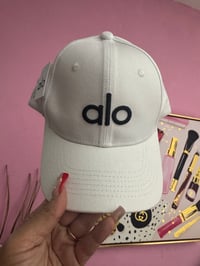Image 1 of White with black letters 