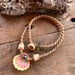 Image of Hawaiian sunrise shell necklace with golden pukas and a locking seaglass clasp