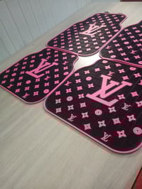 Black w/ pink writing car mats 