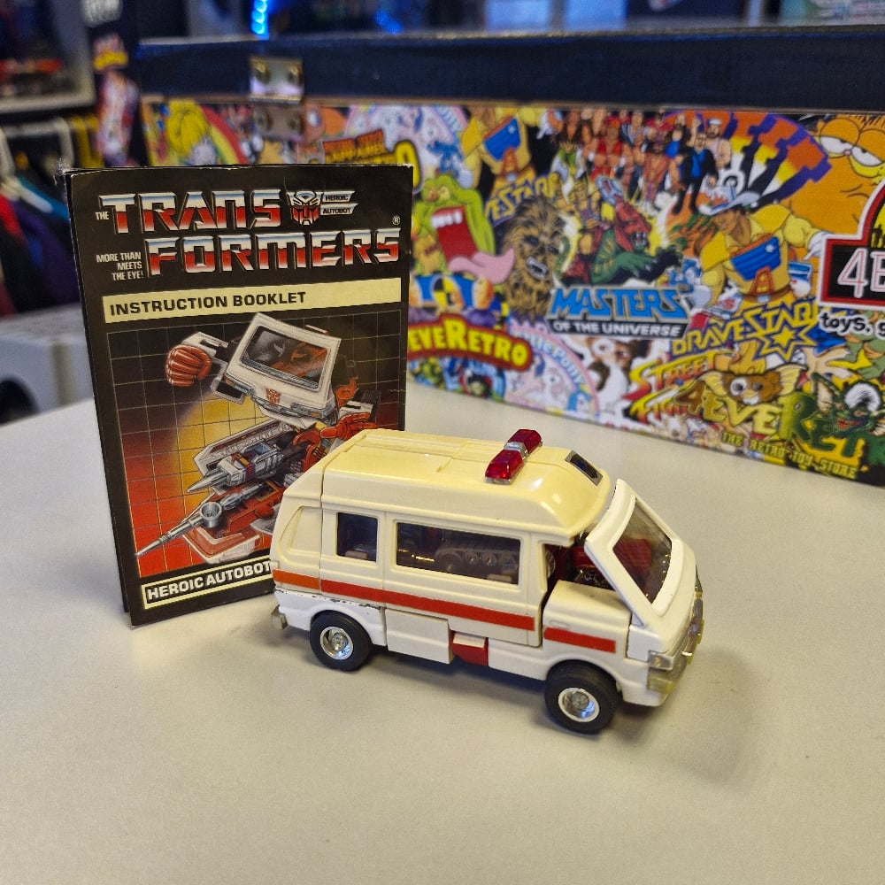 Image of Vintage Transformers G1 Ratchet Autobot Ambulance Figure with Instructions (Missing 1 Missile)