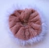 Dusky pink fur scrunchie with feather trim