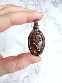 Image 1 of sunstone in copper pendant