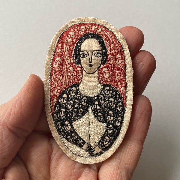 Image of Portrait of a fine woman in black with red - larger embroidery brooch