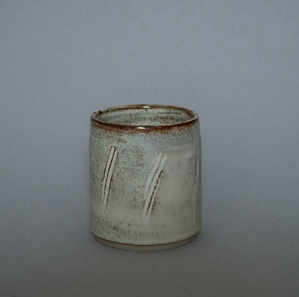 Image of Brown and White Cup / pattern