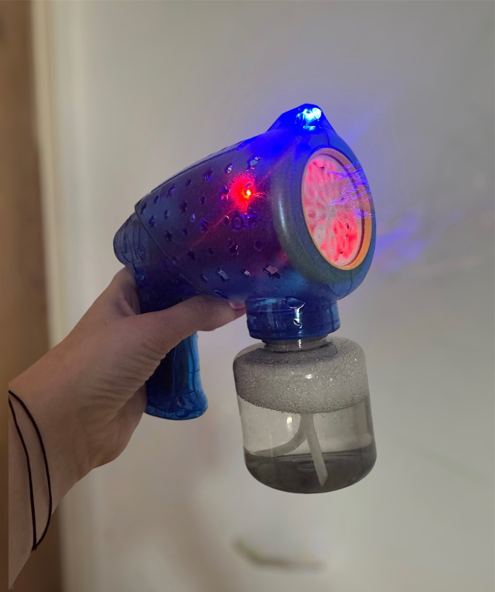 Image of Hand held. bubble Machine