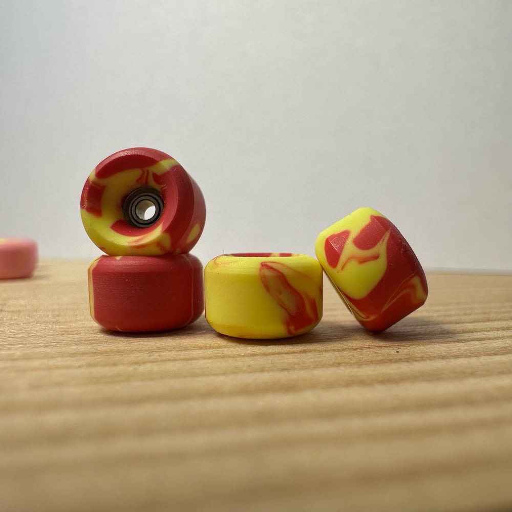 Image of yellow/red swirl wheels 
