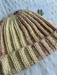 Image 2 of Ribbed crochet beanie in cream and pink