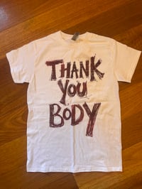 Image 2 of White tshirt with burgundy and flecked orange text (small)