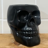 Image 1 of smoked pumpkin scented skull candle