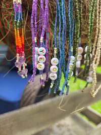 Image 4 of Long beaded purple YEM earrings