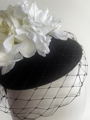 Image of Black felt button trimmed with flowers