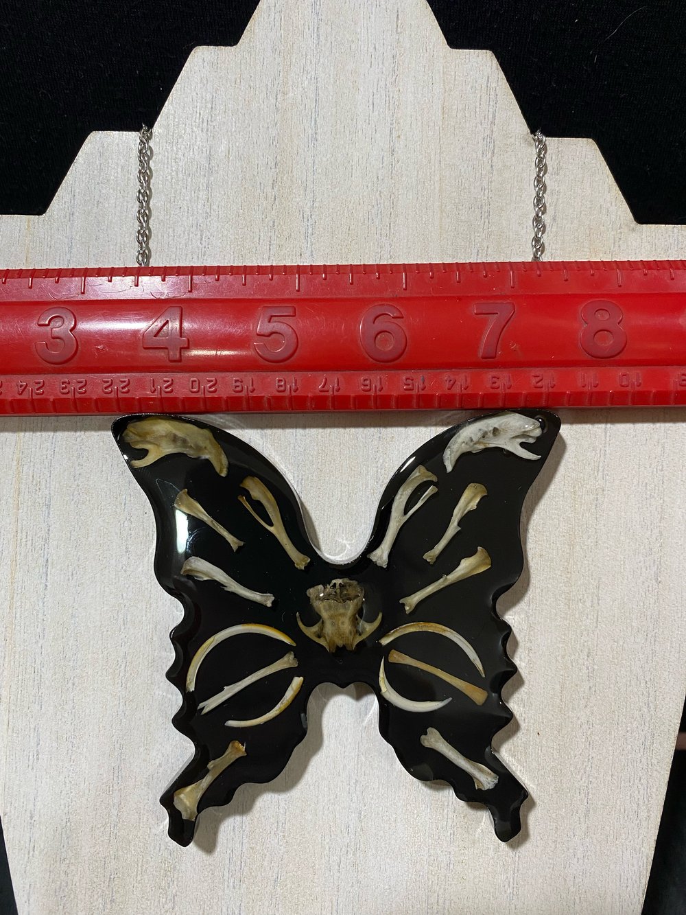 Skull and bone butterfly pendant 