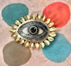 LARGE BRASS PETAL EYE BROOCH 