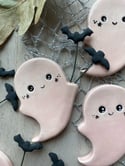 Pink ghosts with pet bats 