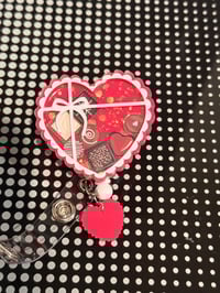 Image 1 of chocolate box badge reel 