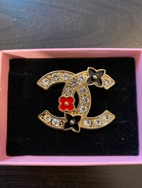 Black and red colorful cc inspired brooch 