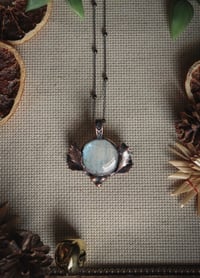 Rainbow moonstone with real holly leaves