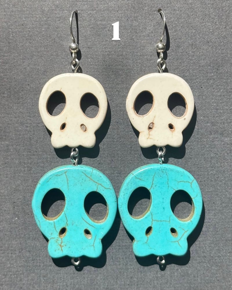 Image of blue skull earrings