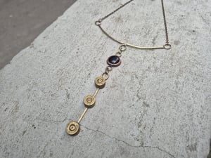 3 bullet casings and black stone necklace  copy