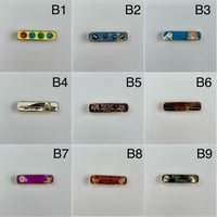Image 1 of Banner Enamel Pins