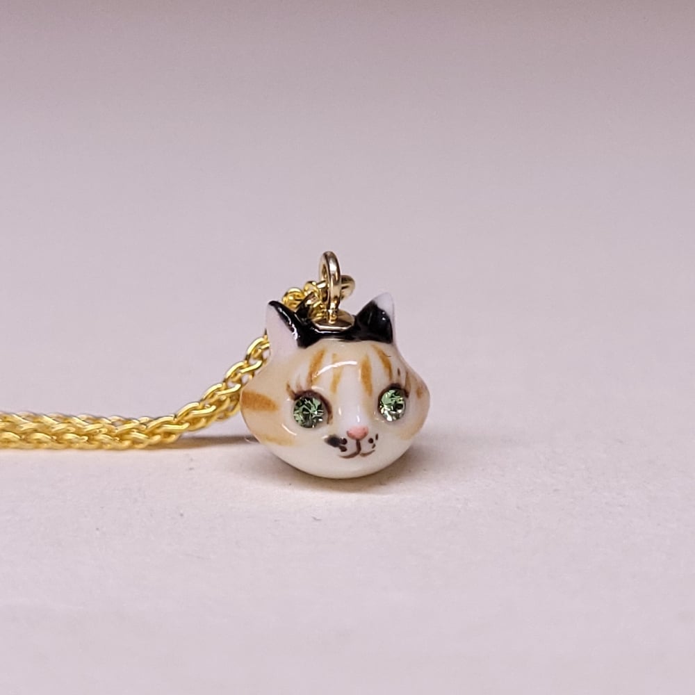 Image of Calico Porcelain & Gold Vermeil Teeny Tiny Cat Pendant