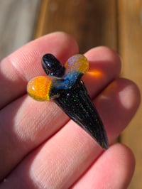 Image 2 of Fully opalized amber purple/ black glass shark tooth pendant 