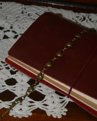 Image 1 of string of hearts bracelet 