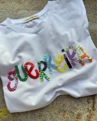 Image 1 of G U E R R E I RA letras cores. Bordada a man. Varias tallas.