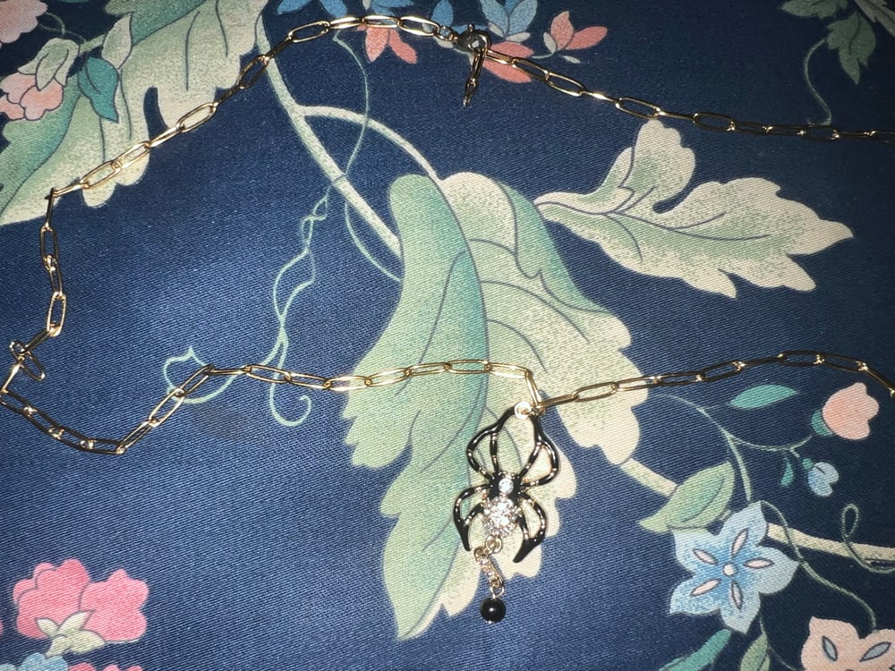 Image of Gold and black long spider necklace 