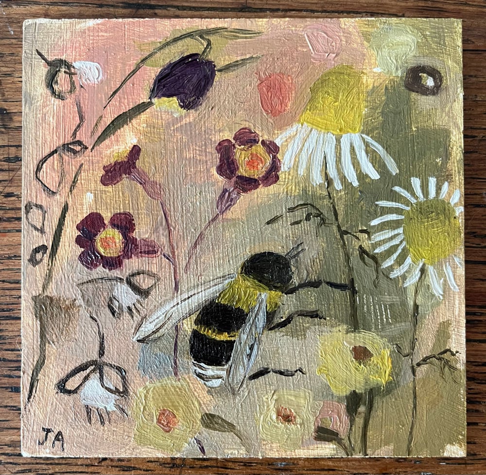 Image of Blossom, primroses and buff tailed bumblebee. 