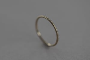 Image of 9ct yellow gold thin milled ring