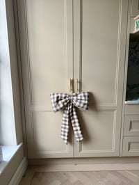 Image 1 of The Oat Check Story Bow