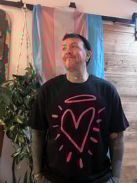 Image 1 of Black tshirt with pink heart logo 