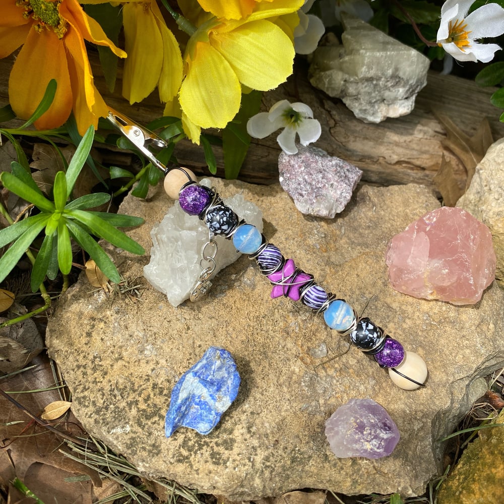 Image of purple shooting star roach clip 