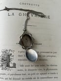 Pendentif en argent massif ouvrant porte-mèche ou porte-photo, fin du XIXème siècle