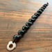 Image of Hawaiian Kupe'e shell bracelet with puka and cowrie lip clasp