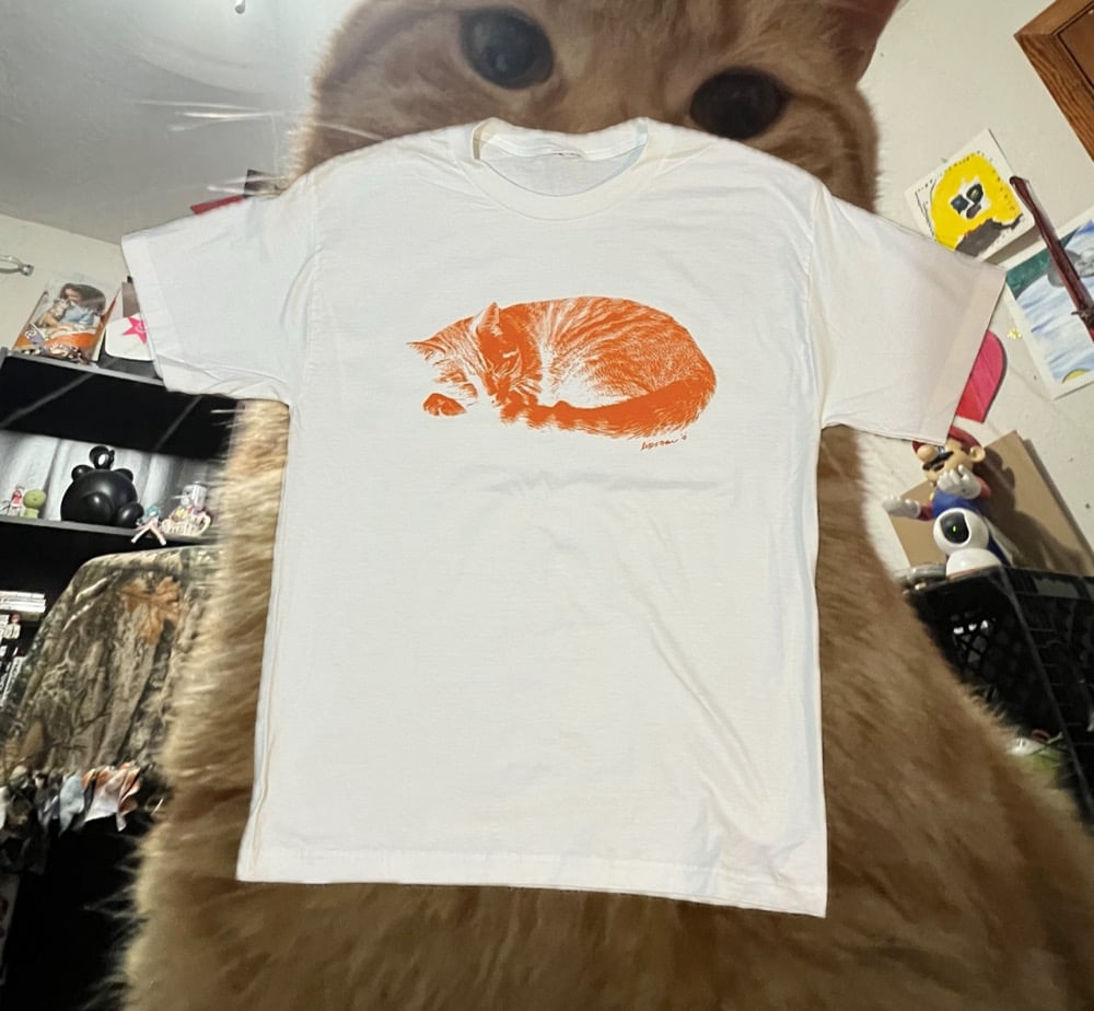 white laying elbow tee