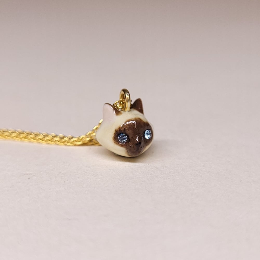Image of Siamese Porcelain & Gold Vermeil Teeny Tiny Cat Pendant