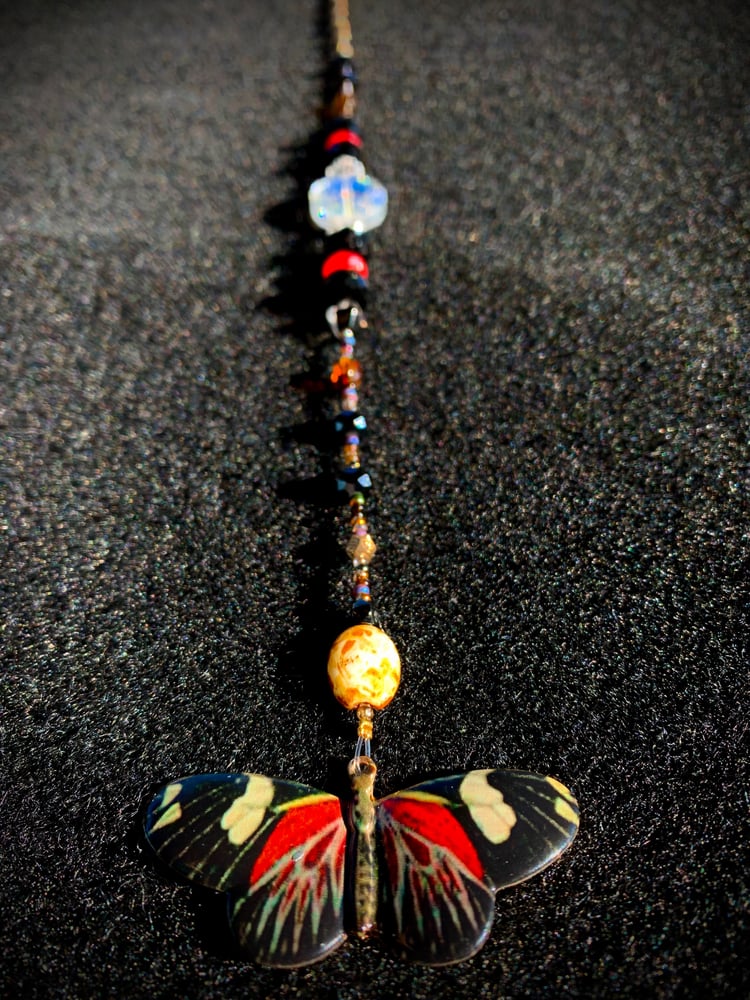 Image of “Colorful Moth” Sun Catcher